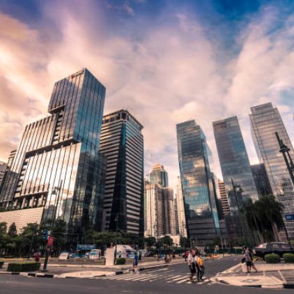Bonifacio Global City, Taguig, Metro Manila - Feb 2021: Fort Bonifacio skyline. Glassy buildings reflect a dramatic afternoon sky.